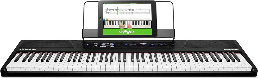 Alesis Recital – 88 Key Digital Piano Keyboard with Semi Weighted Keys, 2x20W Speakers, 5 Voices, Split, Layer and Lesson Mode, FX and Piano Lessons