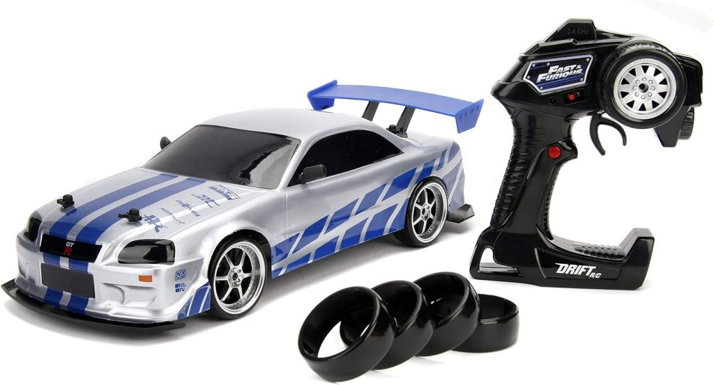 Jada Toys Fast  Furious Brians Nissan Skyline GT-R (BN34) Drift Power Slide RC Radio Remote Control Toy Race Car with Extra Tires, 1:10 Scale, Silver/Blue (99701)
